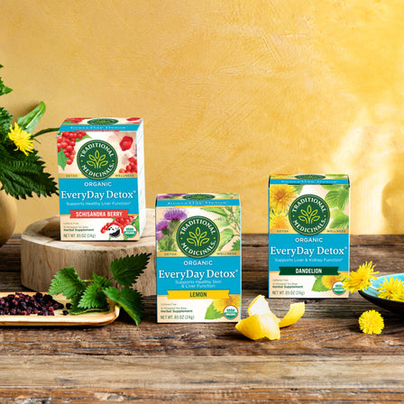 Three boxes of EveryDay Detox® Schisandra Berry Tea, featuring flavors of lemon and dandelion, offer a healthy blend inspired by the Amazonian rainforest.