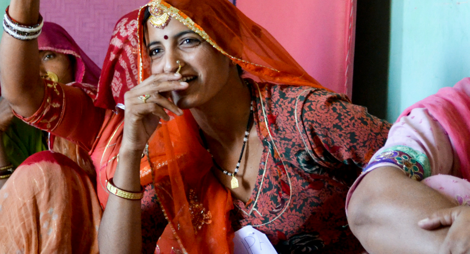 Indian women sitting together, laughing